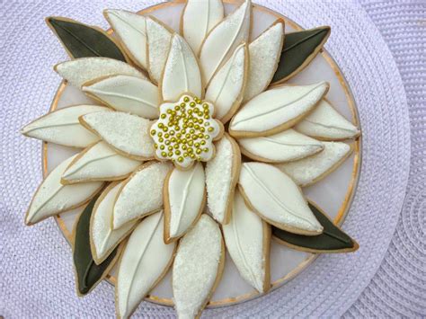 These are 12 christmas cookies for the modern era. White Poinsettia Christmas Cookie Platter | Christmas cookies, Christmas sugar cookies, Best ...