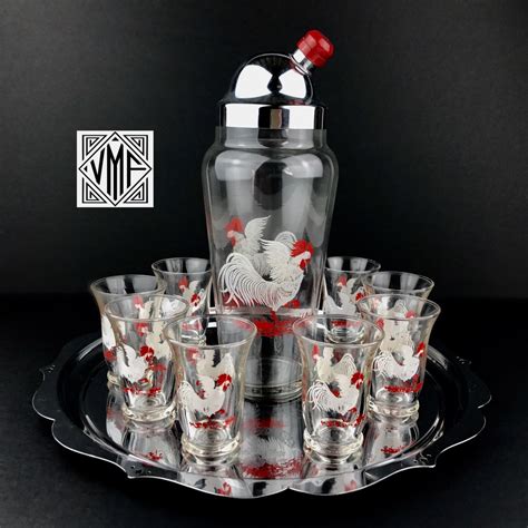 Maybe you would like to learn more about one of these? RARE excellent Art Deco rooster martini cocktail set ...