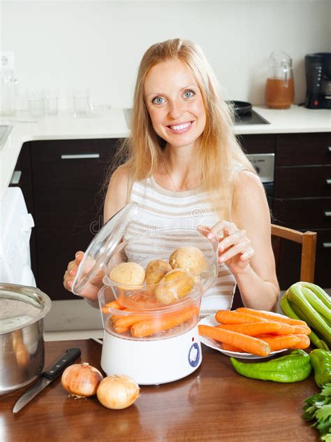 Housewife Cooking Vegetables With Steamer Stock Photo ...