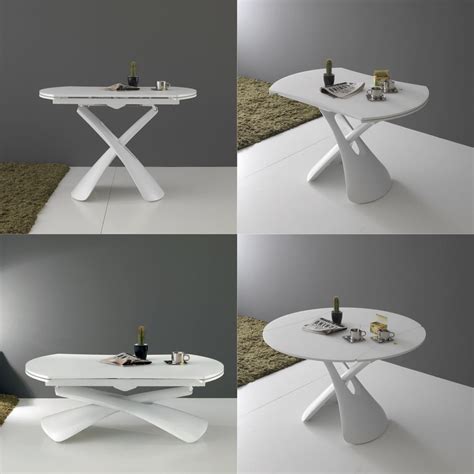 Elle est pratique pour ranger les verres et les bouteilles pour les soirées apéros en famille ou entre amis avec ses deux emplacements sur le côté de la table. Table basse relevable ronde - tendancesdesign.fr