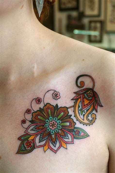 Outside the heart, there is a lot of floral design done. shoulder henna tattoo | Tumblr