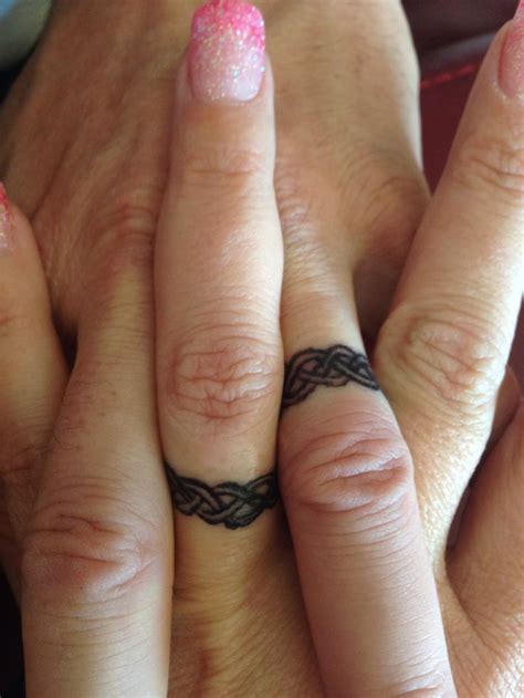 Claddagh tattoo with celtic cross Make a Rocking Couple by Astonishing Ring Tattoos