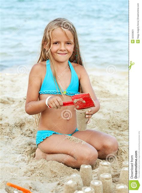 Busty blonde girls get kinky together. Little Girl Playing With Sand On The Beach Stock Image ...