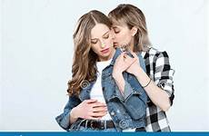 lesbian couple hugging isolated posing together young blue stock