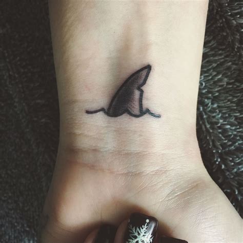 There are various deities, like lono, kane, namaka, papa, etc., that show up in tribal tattoo designs. New shark fin tattoo #littletattoos #sharktattoo # ...