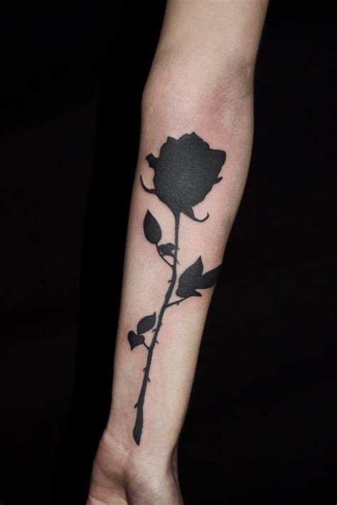 The red rose tattoo is one of the most popular tattoo designs in the world, but the black rose tattoo is slowly catching up. Solid Black Rose Silhouette tattoo on forearm by Ben ...