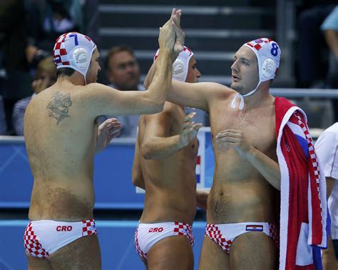 Usa men's water polo's journey ends in quarterfinal loss. Croatia's Petar Muslim (L) celebrates with teammate Andro ...