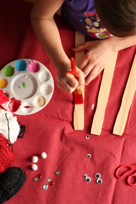 How much do you have to stir paint? Adorable, Paint Stick Santa Craft - Happy Hooligans