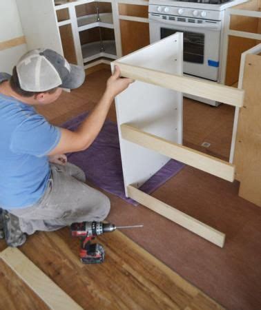 Center the pull horizontally on the top rail of the cabinet. Pin on dishwasher