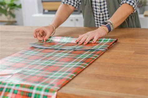 Measure wrapping paper to the size of the object, as if you were wrapping the present without a box, leaving extra room at the top and cut. Make a Gift Bag From Leftover Wrapping Paper | HGTV