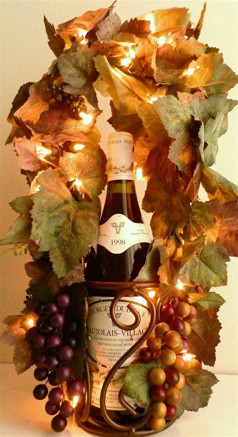 Candles are awesome for your home decor projects, including this one. Tuscan Decor Grapes Vines Lighted Wine Bottle Holder by ...