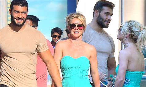 27, born 23 march 1994. Britney Spears and Sam Asghari hold hands at Disney park ...