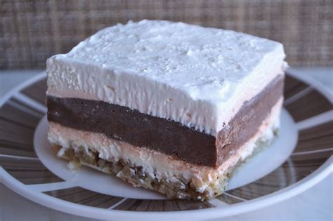 Layered dessert with chocolate pudding, cream cheese and cool whip on top of a pecan shortbread crust. 7kidsathome: Layer Dessert