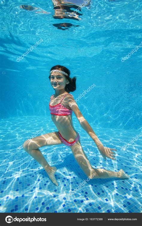 This information might be about you, your preferences or your device and is mostly used to make the site work as you expect it to. Teen girl posing under water in the pool — Stock Photo © a ...