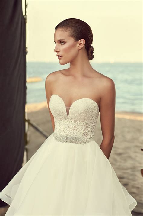 Corsets are often styled in various ways to hide away those extra inches and get that desired hourglass shape. Strapless Corset Wedding Dress - Style #2192 | Mikaella Bridal