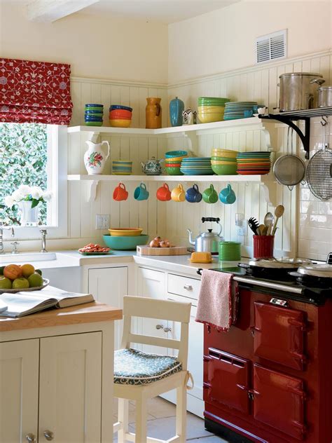 Terracotta painted walls and ceiling stop the dark grey cabinets feeling cold and dull, and the orange worktop complements the copper kitchen handles. Pictures of Small Kitchen Design Ideas From HGTV | HGTV