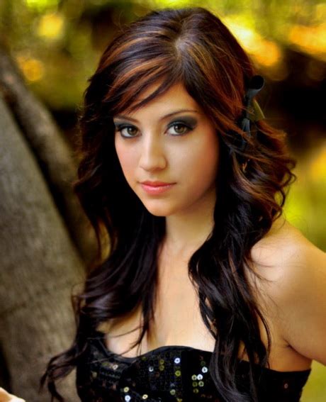 Thick hair becomes soft and smooth with this wavy style. Haircuts for long wavy hair