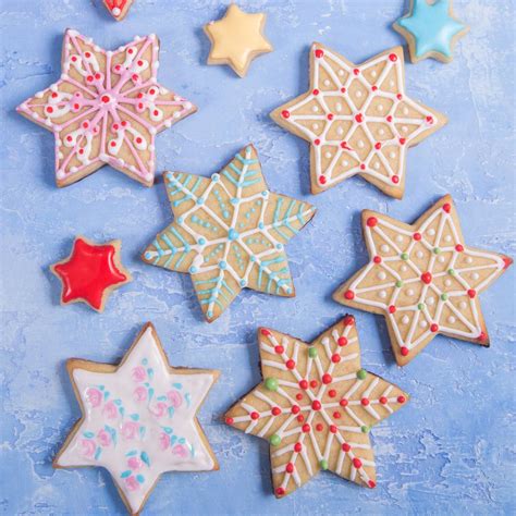 Star shaped cookie cutters red & blue fondant battery operated lights & batteries stripe embossing mat serving tray white paper shred … lighted star cookies! Christmas Star Sugar Cookies | Star sugar cookies, Cute christmas cookies, Christmas cookie icing