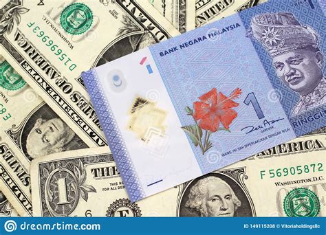 Malaysian ringgit (myr) to taiwan dollar (twd) converter. A Malaysian Ringgit On A Background Of One Dollar Bills ...