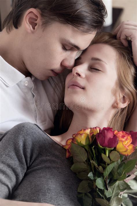 Young, a loving couple stock photo. Image of women, flowers - 22882436