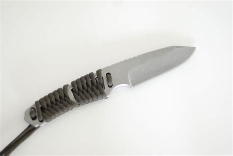 This blade is one solid piece of good quality, gray coated, stainless steel from tip to butt. Bear Grylls Paracord knife mod | EDCForums