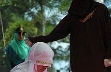punishment caned woman allowed brutal women men adultery caning muslim man times law province implement populous sharia majority islamic country