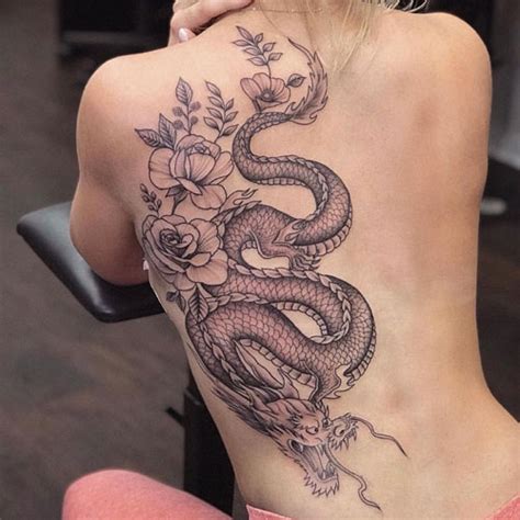 Adding a soft floral element provides a contrast to the energy and the combination of dragon and tiger is significant in buddhist culture. 125 Best Tattoos For Women: Unique Female Tattoo Ideas (2021)