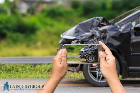 Firefighter near truck with equipment with water water hose over shoulder. Best Car Accident Attorney Near Me: Where Can I Find the Best