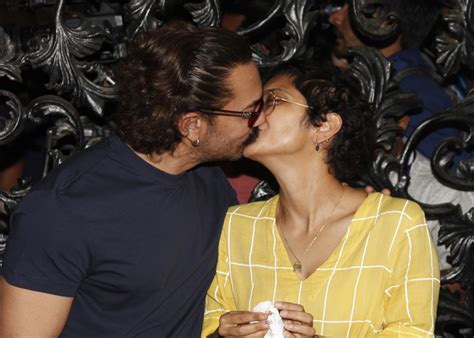 Bollywood superstar aamir khan is a complete family man. Aamir Khan steals a kiss with his wife Kiran Rao on his ...