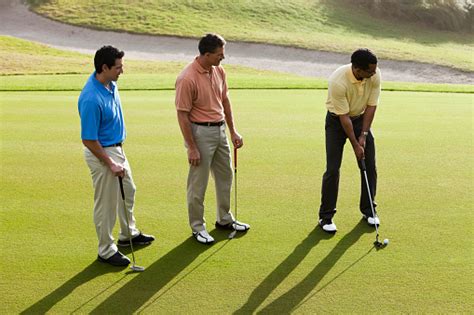 Golf ball on the green a golf ball is on the green.here are some more golf/grass images: Men On Golf Course Putting Green Stock Photo - Download ...