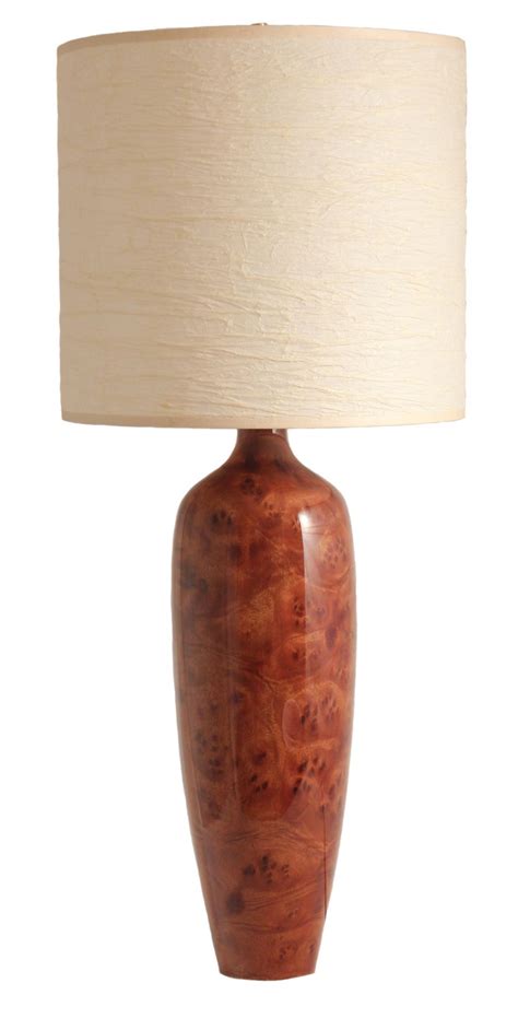 This is a tall thin table lamp with a camphor burl base ...