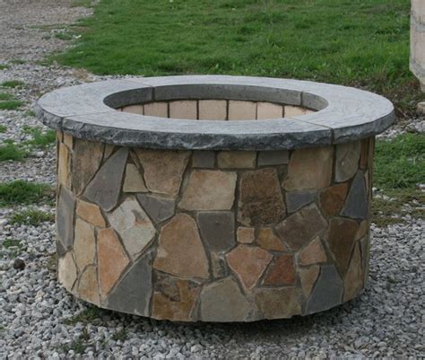 Measures 30t x 25w recommended. Tall Round fire pit in natural stone veneer. | Natural stone fireplaces, Natural stone veneer