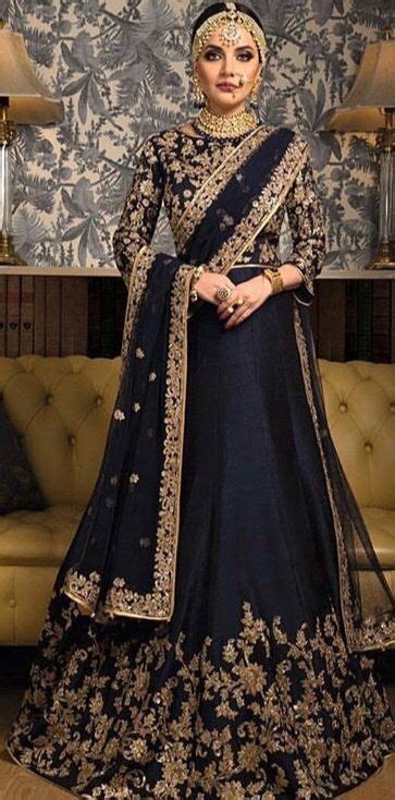 Go for pastels like sky blue or brights like pink, depending on what suits you! Regal looking navy blue and gold Indian bridal outfit # ...