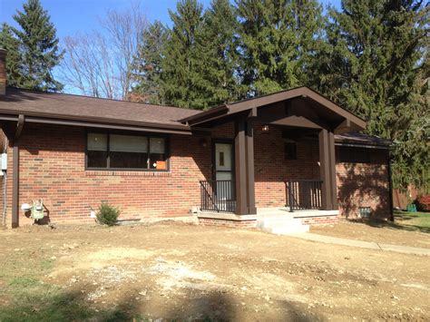 Several years past, our house was robbed, and it's an incredibly personal and invasive act. Front porch with wrought iron railings - Lux Design and ...