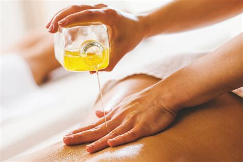 Asian japanese massage 2019 | 00314:48. Woman Pouring Massage Oil On Spa Client Stock Photo ...