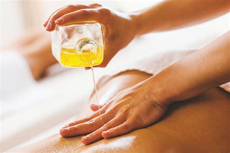 The latest tweets from hot_massage (@hotmassage4). Woman Pouring Massage Oil On Spa Client Stock Photo ...