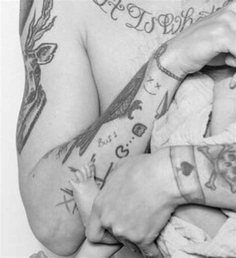 Louis tomlinson dagger temporary tattoo sheet of temporary tattoos. Louis Tomlinson Tattoos And Meanings: From His Giant Chest ...