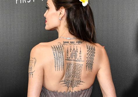 Here is a list of 9 best angelina jolie tattoos that makes a wonderful look. Angelina Jolie Shows Off Massive Back Tattoo While Making ...