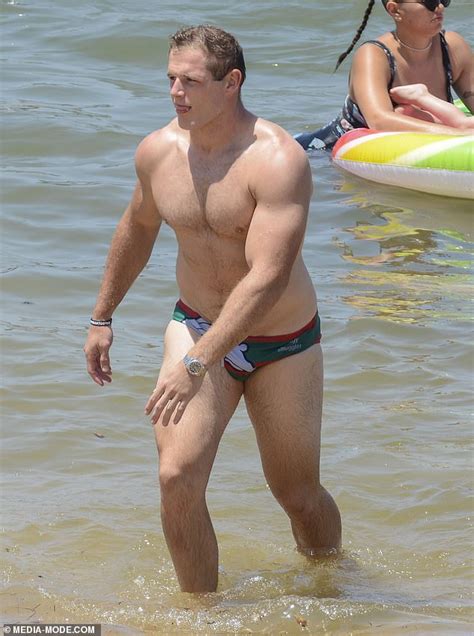 'when i'm in the water it feels like he's right there': No dad bod here! George Burgess flaunts his muscular frame ...