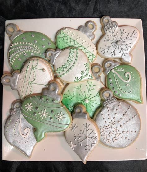 Diane has whipped up a storm including snowflake, reindeer, snowman cookies. Sugar cookies decorated to match my tree ornaments in silver, white and g… | Christmas cookies ...