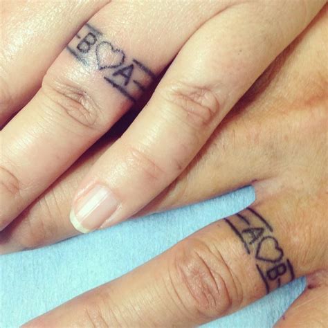 Tribal heart tattoos tribal tattoos for men tattoos for guys deviant art pretty tattoos cool tattoos initals tattoo tattoo ringe diy tattoo. initials and heart #fingertattoos | Wedding band tattoo, Tattoo wedding rings, Wedding ring ...
