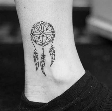 This tattoo is one of a kind starting with the wolf heads, slanted upwards howling as we see, portraying a sense of mystery and power probably. 50 Gorgeous Dreamcatcher Tattoos Done Right - TattooBlend