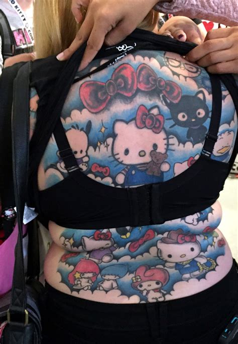 Small hello kitty tattoo on behind the ear. Hug Life: Four Days in a Hello Kitty Convention Tattoo ...