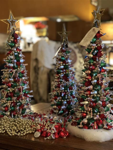 I have no idea how old this tree is, or if at one time it ever was decorated in candles. Hershey KIss Christmas Tree | Hershey kisses christmas ...