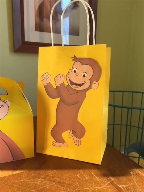 Connection communities etiquette & advice floral heart project igtv introduce little ones to the magical world of curious george with our keepsake gift collection. Curious George Gift Bag | eBay | Casamiento