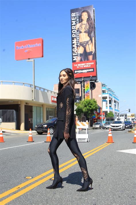 Normalcy is slowly returning to american life. MEGAN PORMER in Front of Her Billboard on Sunset Blvd in ...