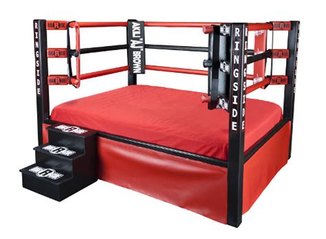 A modern ring, which is set on a raised platform, is square with a post at each corner. Boxing Ring Bed - Agazoo