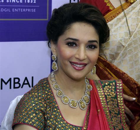 The secret of madhuri dixit's toned figure is regular exercise. Madhuri Dixit High Definition Photos in Saree - trionic 88 ...
