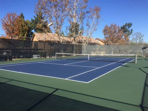 Here is a nice tennis court to the side of this estate. Irvine Tennis Courts | Tennis court, Tennis, Sports stadium