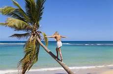 caribbean beach sunbathing tropical woman young palm westend61 getty alternatives tree